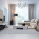 white modern living room with white coffee table and white throw rug.