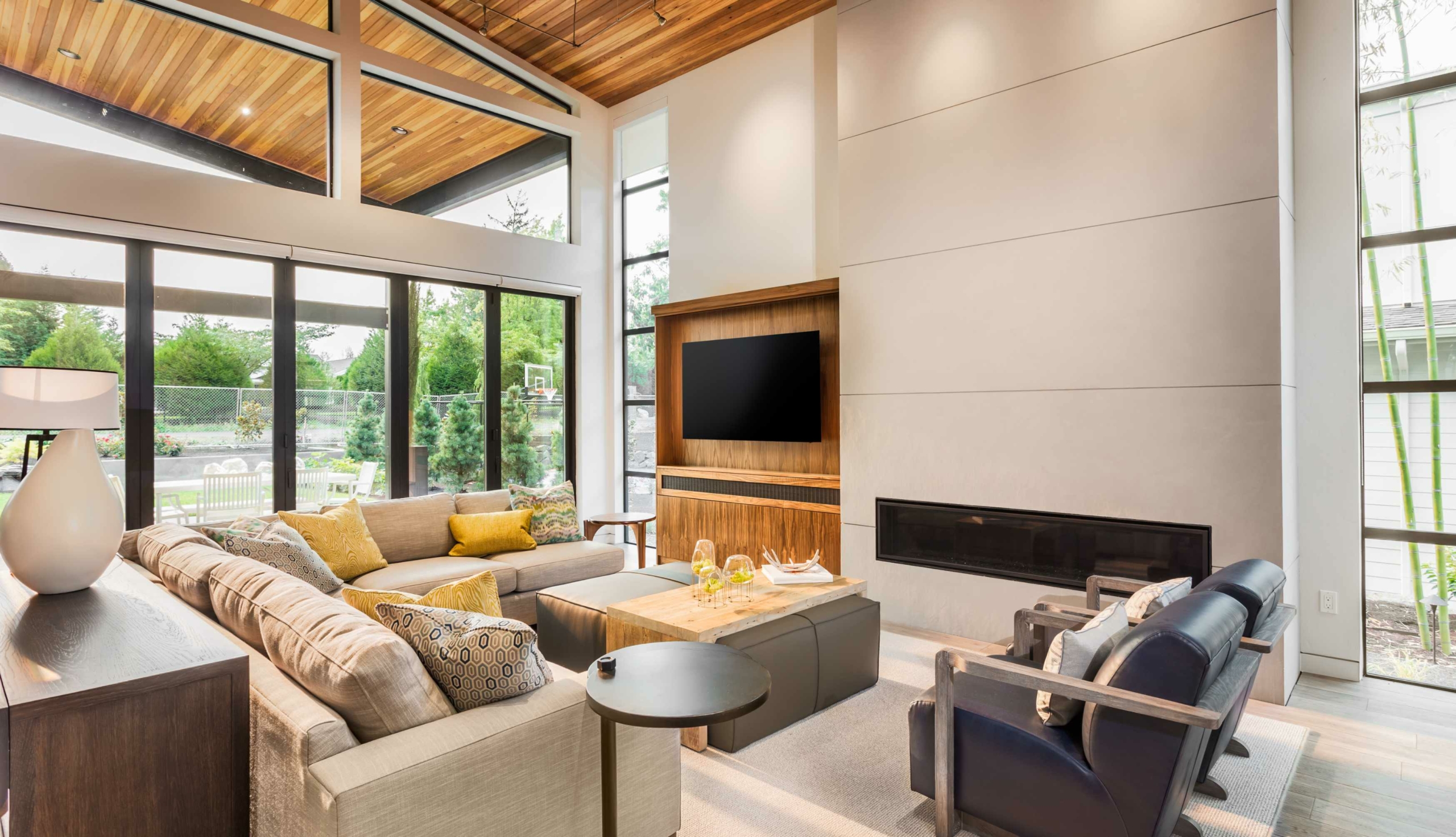 modern living room with modern fireplace and a white throw rug.