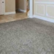 empty room with grey carpet and tan walls