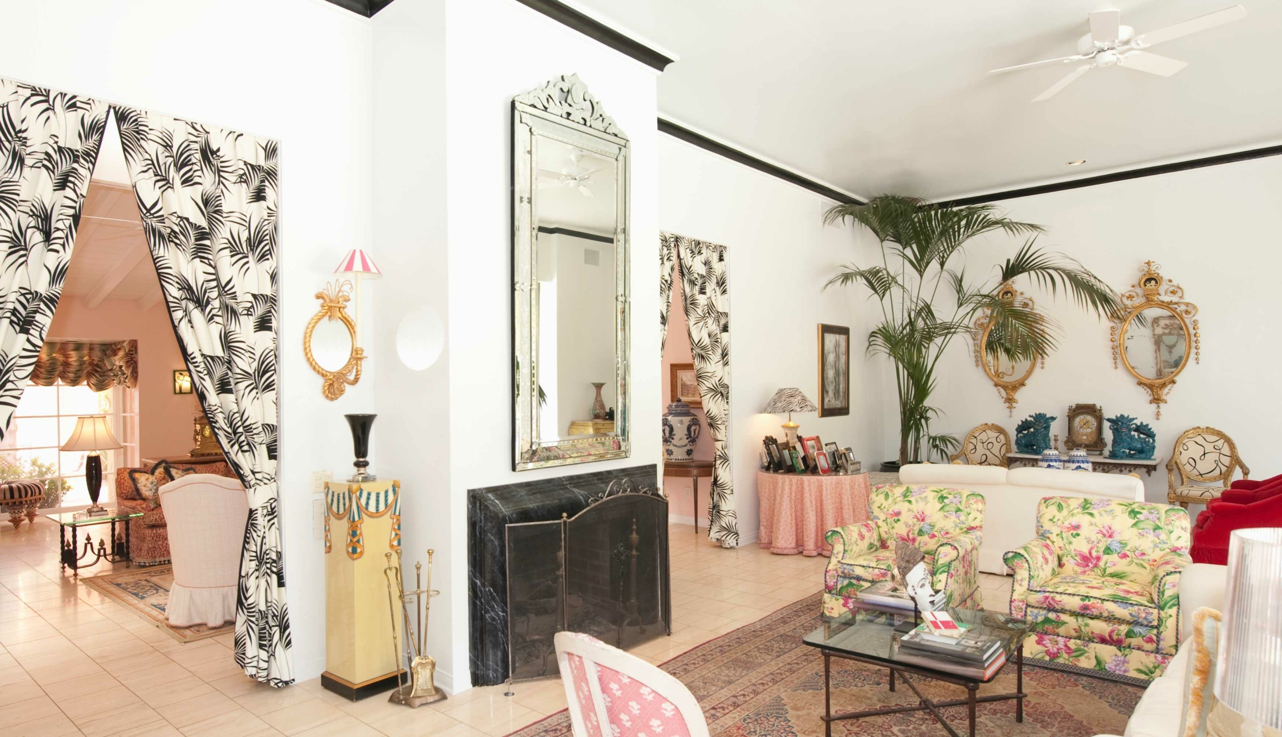 formal living room with floral chairs and ornate decorations