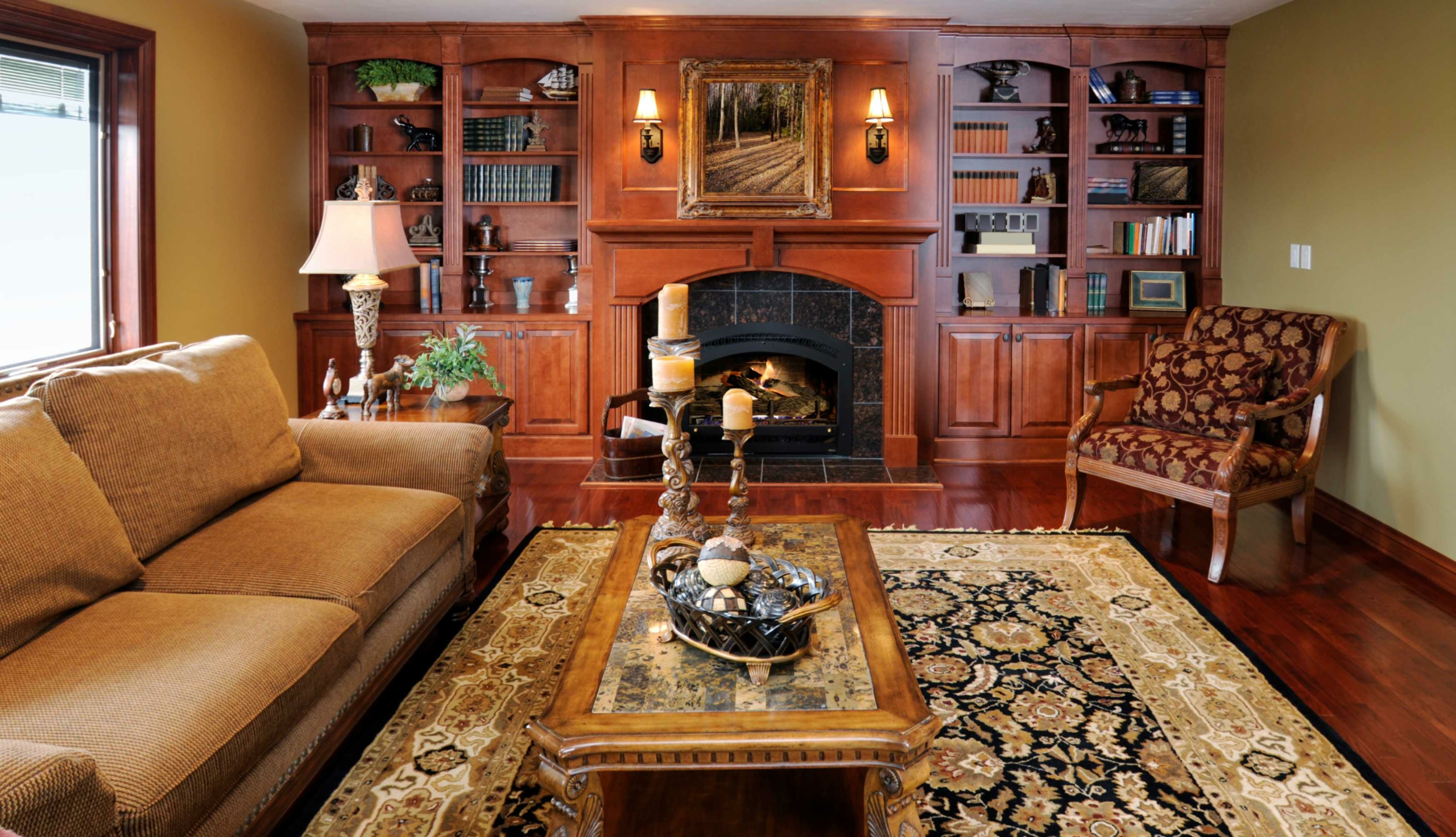 rustic living room with gold throw rug and fireplace