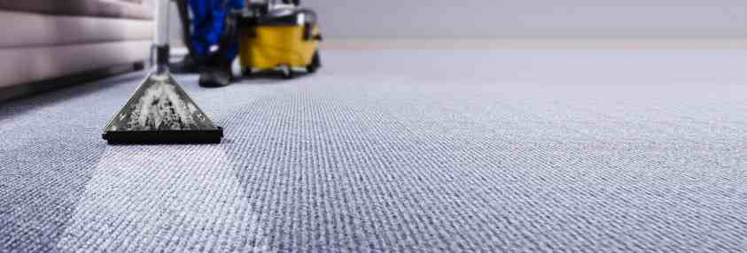 professional carpet cleaning with a yellow machine