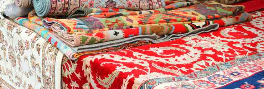 mulit colored rugs on display