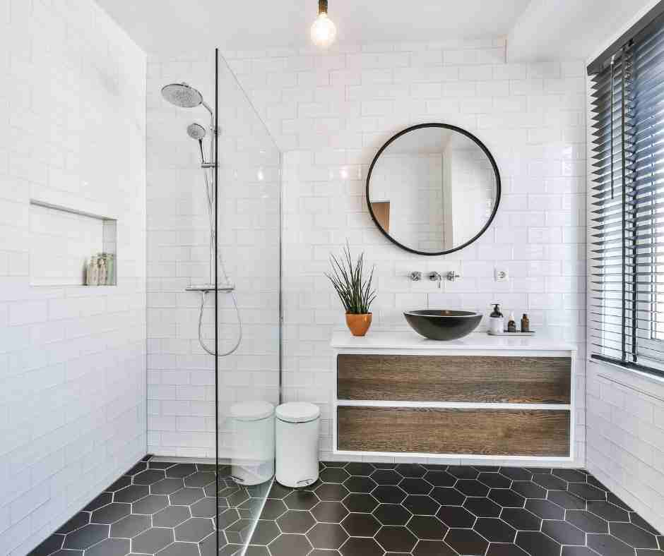 bathroom with black floor tile